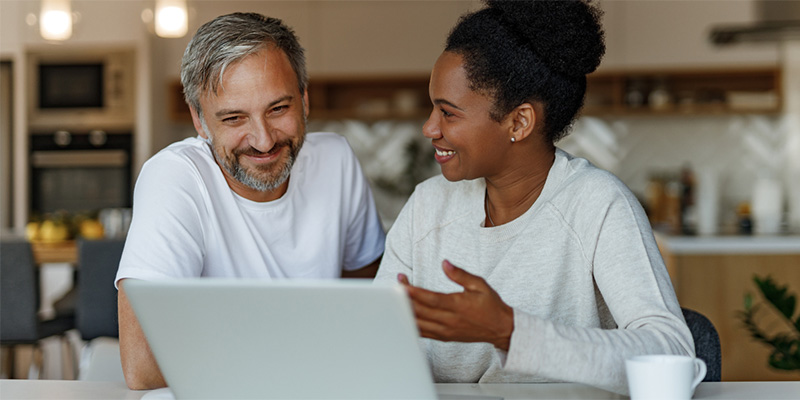 Couple reviewing policy online