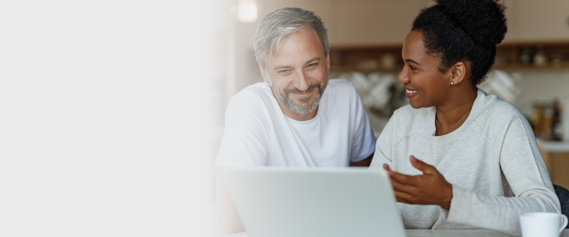Couple reviewing policy online