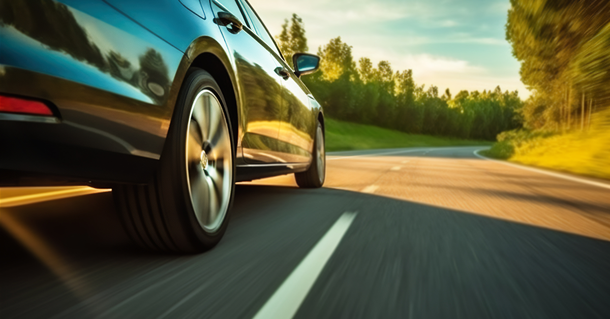 Car in motion driving on a road